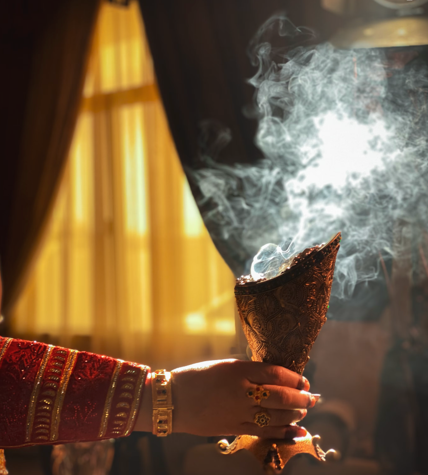 smoky oud with a hand