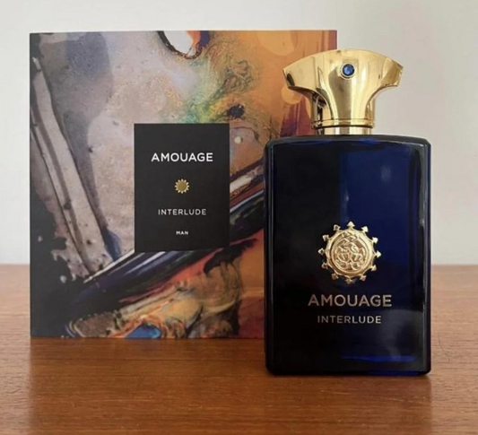 blue bottle of amouage perfume along with packaging