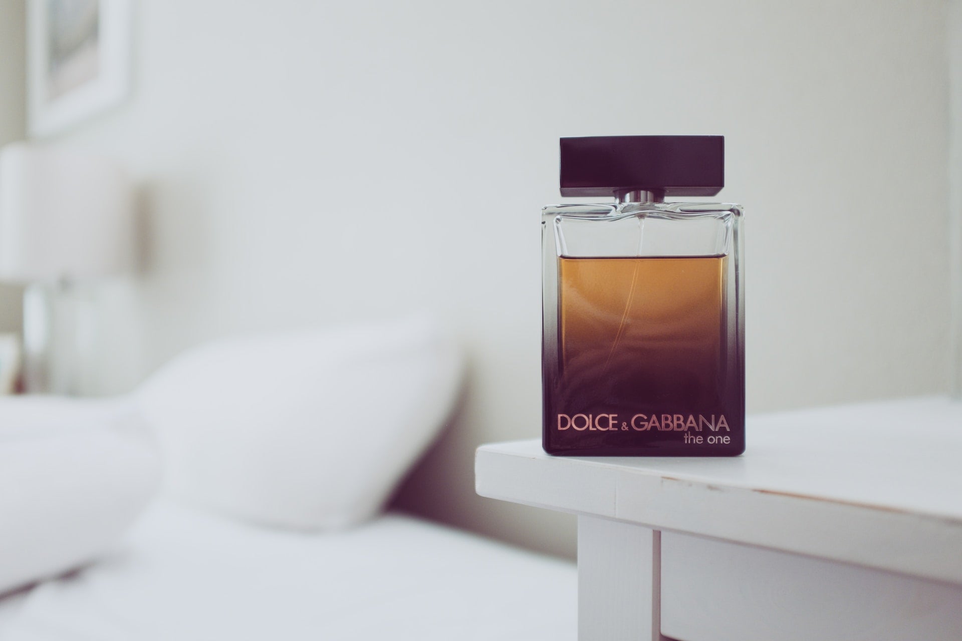 bottle of dolce and gabbana the one on the night stand