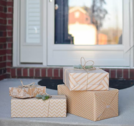 boxes and gifts set neatly onto a porch in the daytime