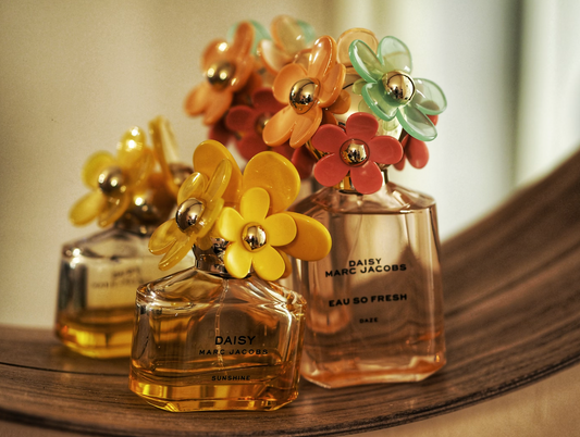 collection of daisy marc jacobs perfume bottles