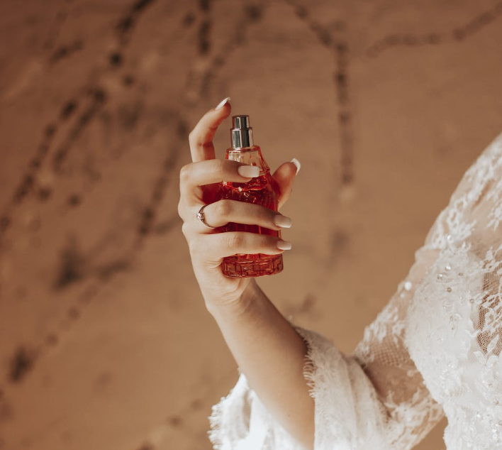 woman holding a perfume bottle that won't spray