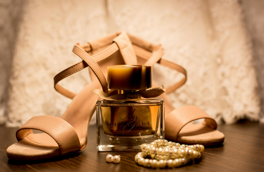 bottle of my burberry perfume place in front of women's sandals