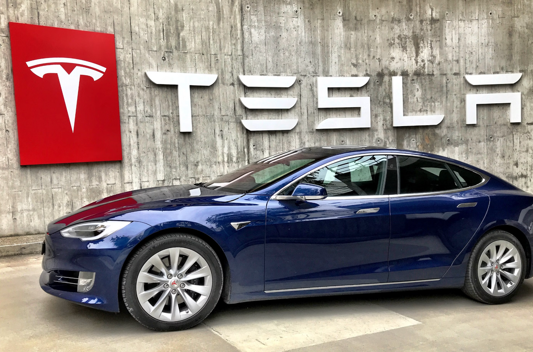 Elon Musk's Tesla showroom with a blue electric vehicle
