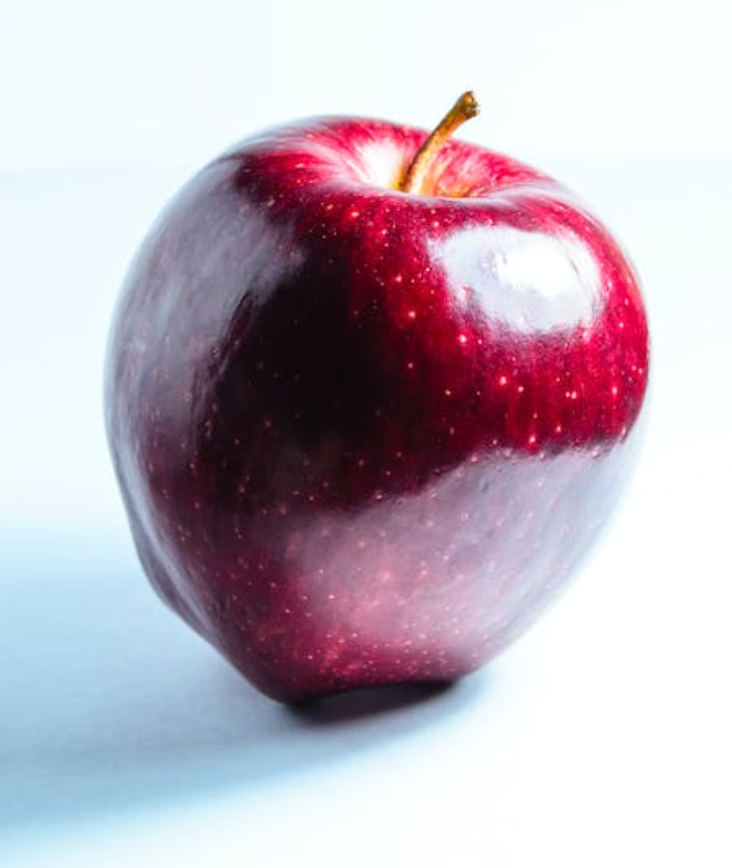 1 red apple with light shining on it