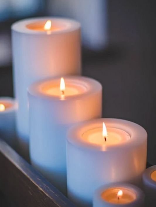three white pillar candles