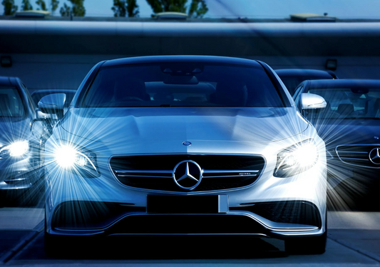 photo of a white mercedes benz car on the road