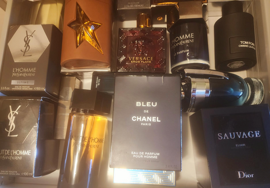 photo of a cologne collection of an assortment of colognes from brands like ysl, thierry mugler, versace, chanel, tom ford, and dior