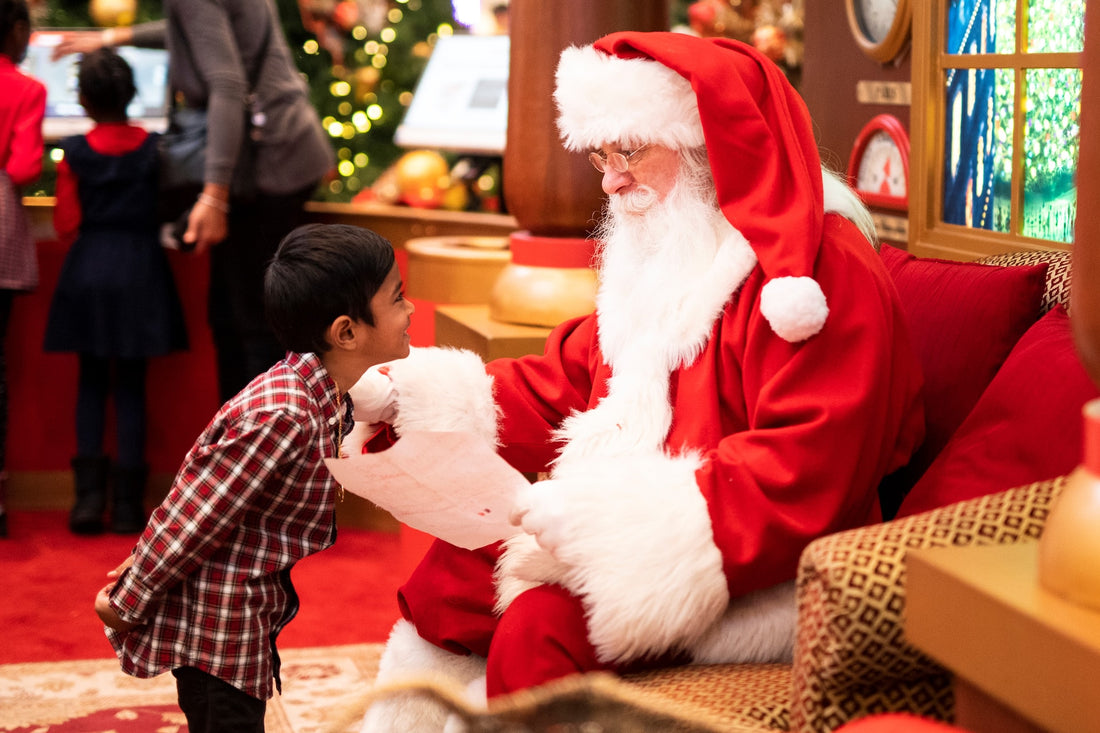 santa claus greeting a young child