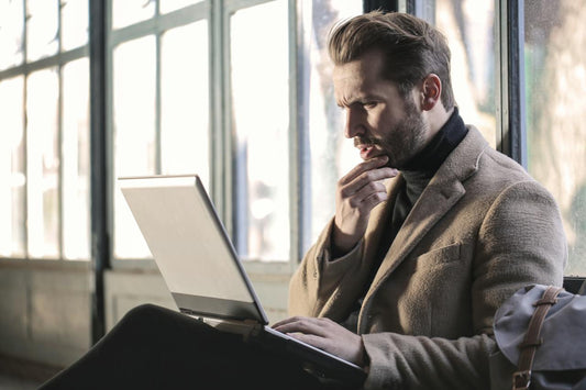 man shopping for perfumes online for his girlfriend