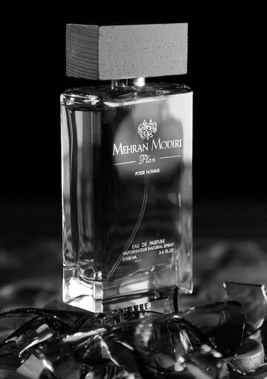 grayscale photo of a 3.4 oz. bottle of mehran modiri pour homme fragrance