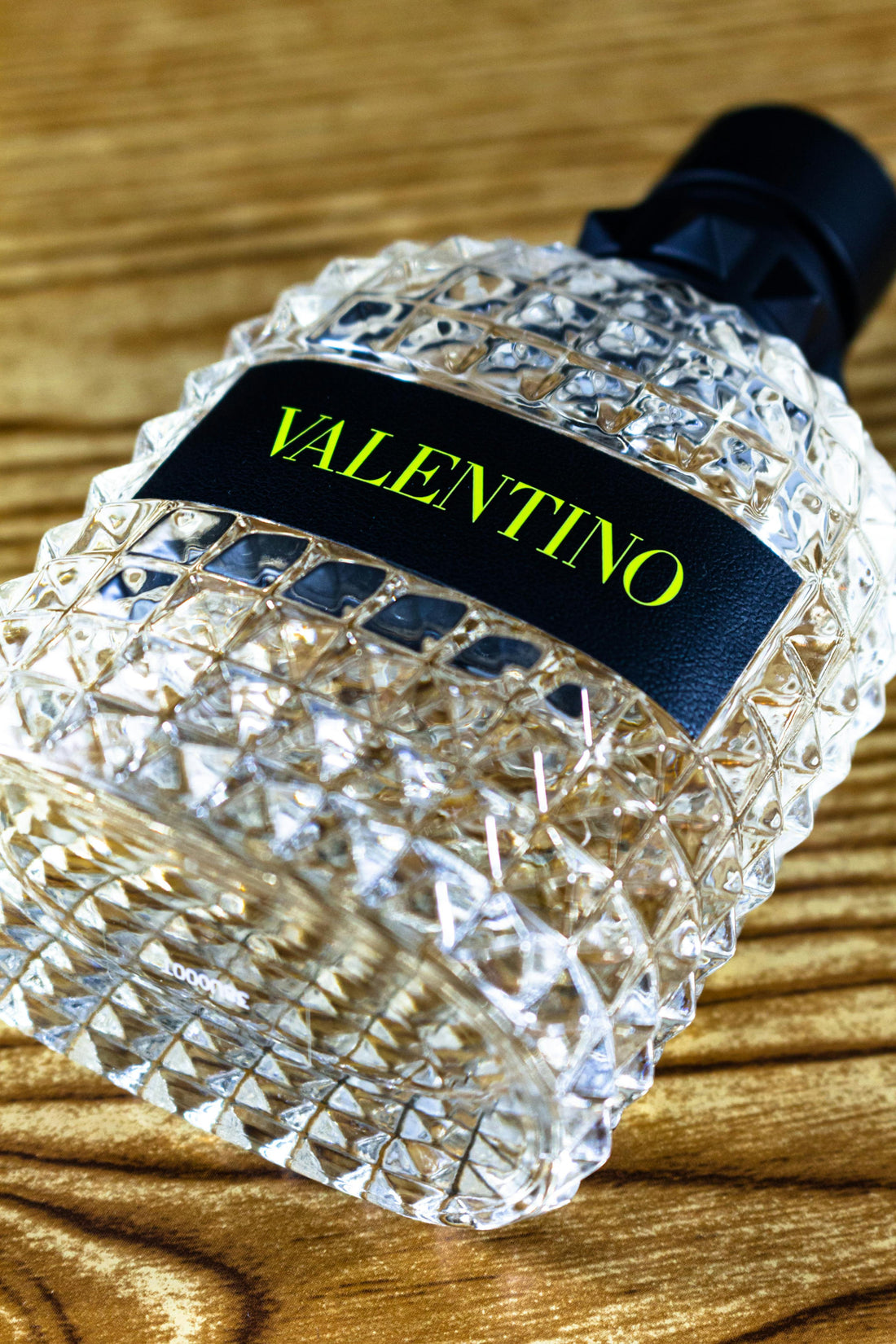 bottle of valentino perfume with green brand color