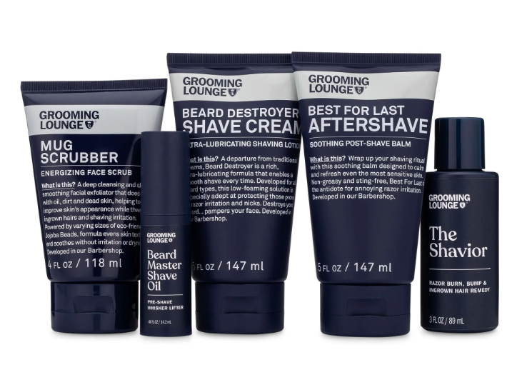 image with 5 shaving products including a scrubber, shave oil, shave cream and aftershave